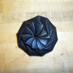 Rotary-folding coin purse, closed.