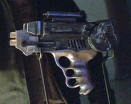 The Lassiter laser pistol from Firefly episode 11.  Note identical handle with toy to right.