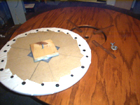 Lazy susan made from 2' MDF circle, bearing, and scrap board. Covered with Scotch-guarded white canvas.