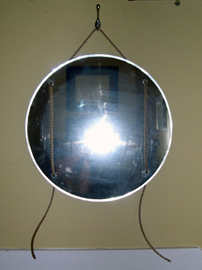 Front shot of mirror taken with flash, showing beveled edge.