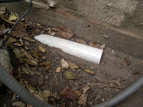 Positioned correctly, the cut pipe looks like a small piece of a much larger, buried pipe.