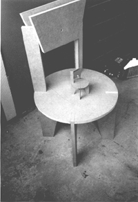 The first prototype of the puzzle chair, here executed in 3/4in. MDF, was wasteful of material and required the use of fasteners. It was also uncomfortable, having a back exactly perpendicular to the plane of the seat.