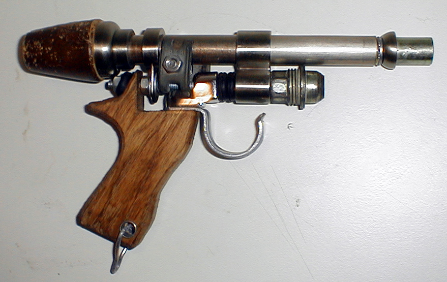 This gun is made from several dozen found objects.  Right click for larger image.