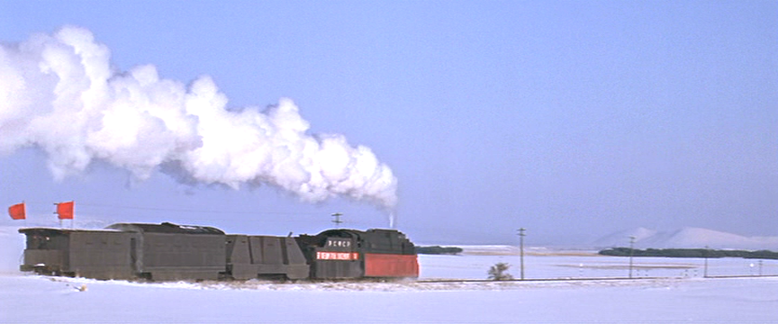 Rear view of Strelnikov's train as it recedes.