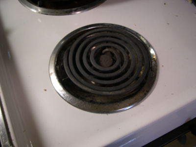 Visible-light digital photograph of stove burner, 1 of 7.