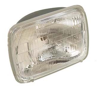 Original headlight showing front lens.