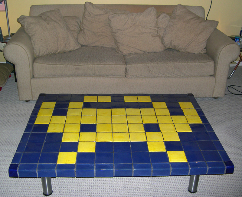 Wide shot of coffee table, with couch showing scale.