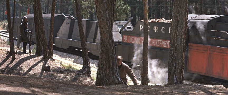 Shot through the forest showing some details of rear cars.